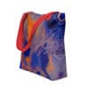 Red-handled tote bag with abstract art.