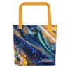 Abstract art tote bag with orange handles.