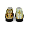 A pair of shoes with a yellow and white design.