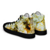 A pair of shoes with yellow and white marble design.
