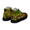 A pair of shoes with grass and trees on them.