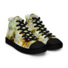 A pair of shoes with yellow and white flowers.