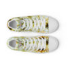 A pair of shoes with yellow and white pattern.