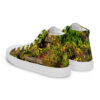 A pair of shoes with grass and trees on them.
