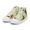 A pair of shoes with yellow and white flowers on them.