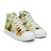 A pair of shoes with yellow and white flowers on them.