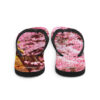 A pair of flip flops with pink flowers on them.