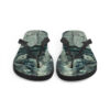 A pair of flip flops with a picture of trees.