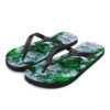 A pair of flip flops with green and white paint.