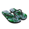 A pair of flip flops with green and white flowers.