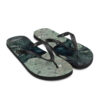A pair of flip flops with a picture of the ocean.