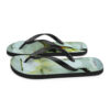 A pair of flip flops with a picture of a flower.