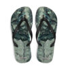 A pair of flip flops with a picture of rocks.