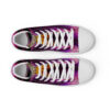 A pair of purple and white shoes with the words " live life " on them.