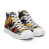 A pair of colorful sneakers on top of a white shoe.