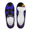 A pair of shoes with the top view of a bird.
