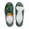 A pair of shoes with green leaves on them.