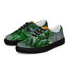 A pair of shoes with green leaves on them.