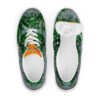A pair of shoes with green leaves and orange accents.