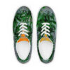 A pair of shoes with green leaves on them.