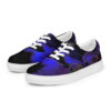 A pair of blue and black shoes on top of a white shoe.