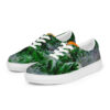 A pair of shoes with green leaves on them.