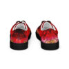 A pair of red shoes with a design on them.