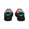 A pair of shoes with red, green and black design.