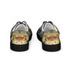A pair of shoes with an image of a fish on them.