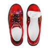 A pair of red shoes with an abstract design.