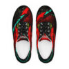 A pair of red and black shoes with green accents.
