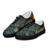 A pair of shoes with trees and birds on them.