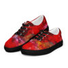 A pair of red shoes with black sole and colorful design.