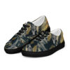 A pair of shoes with gold and black camouflage.