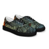 A pair of shoes with trees and birds on them.