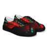 A pair of shoes with red and green paint on them.