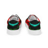 A pair of shoes with red, green and black designs.