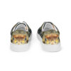 A pair of shoes with a picture of a fish on them.