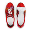 A pair of red shoes with a painting on them.