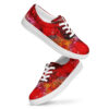 A pair of red shoes with white soles and colorful designs.