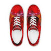 A pair of red shoes with a painting on them.