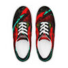 A pair of shoes with red and black paint on them.