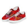 A pair of red shoes with a painting on them.