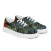 A pair of shoes with trees and sky in the background.