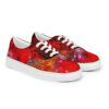 A pair of red shoes with flowers on them.