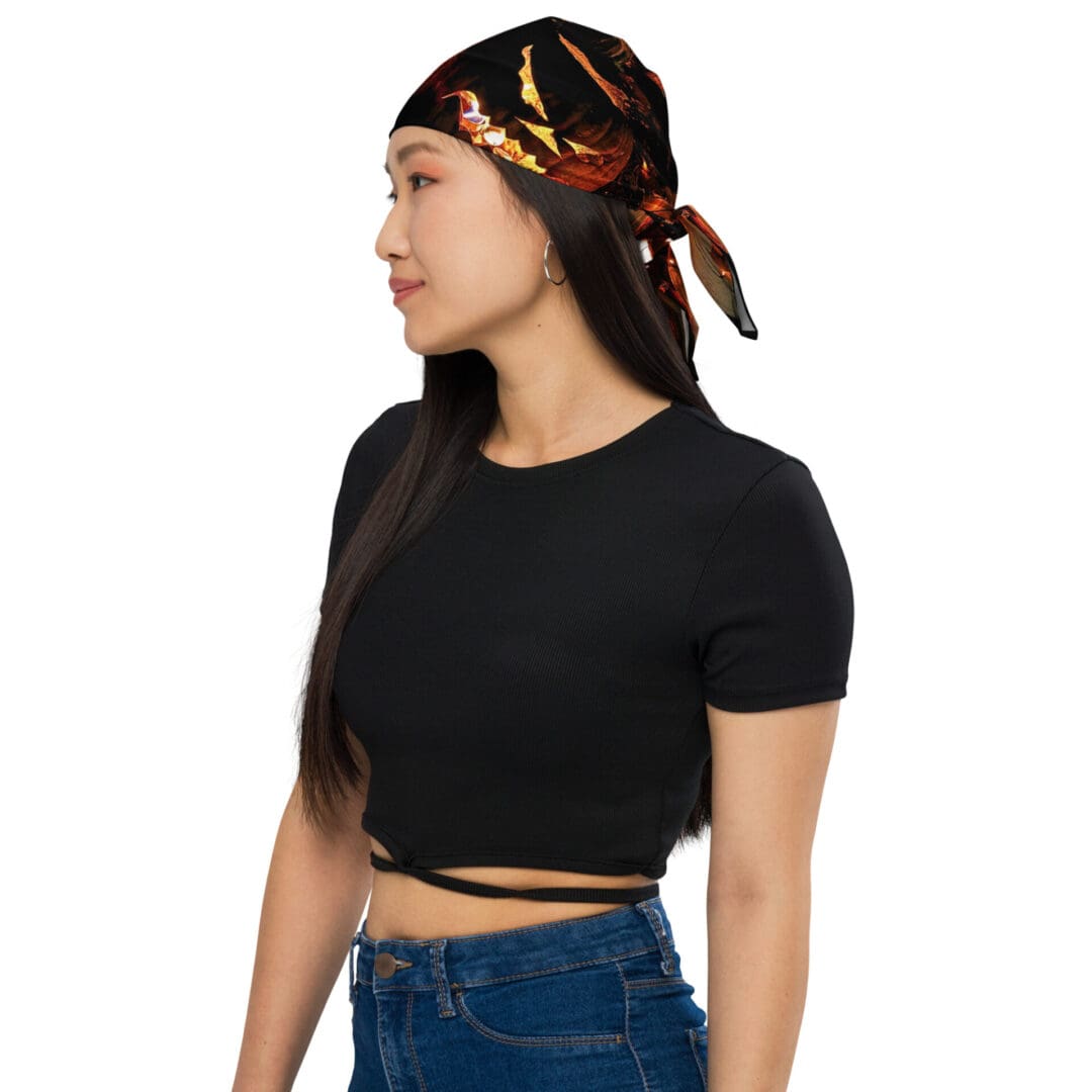 Woman wearing bandana and black top.