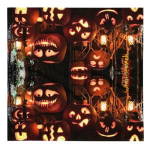 Halloween jack-o'-lanterns glowing in darkness.
