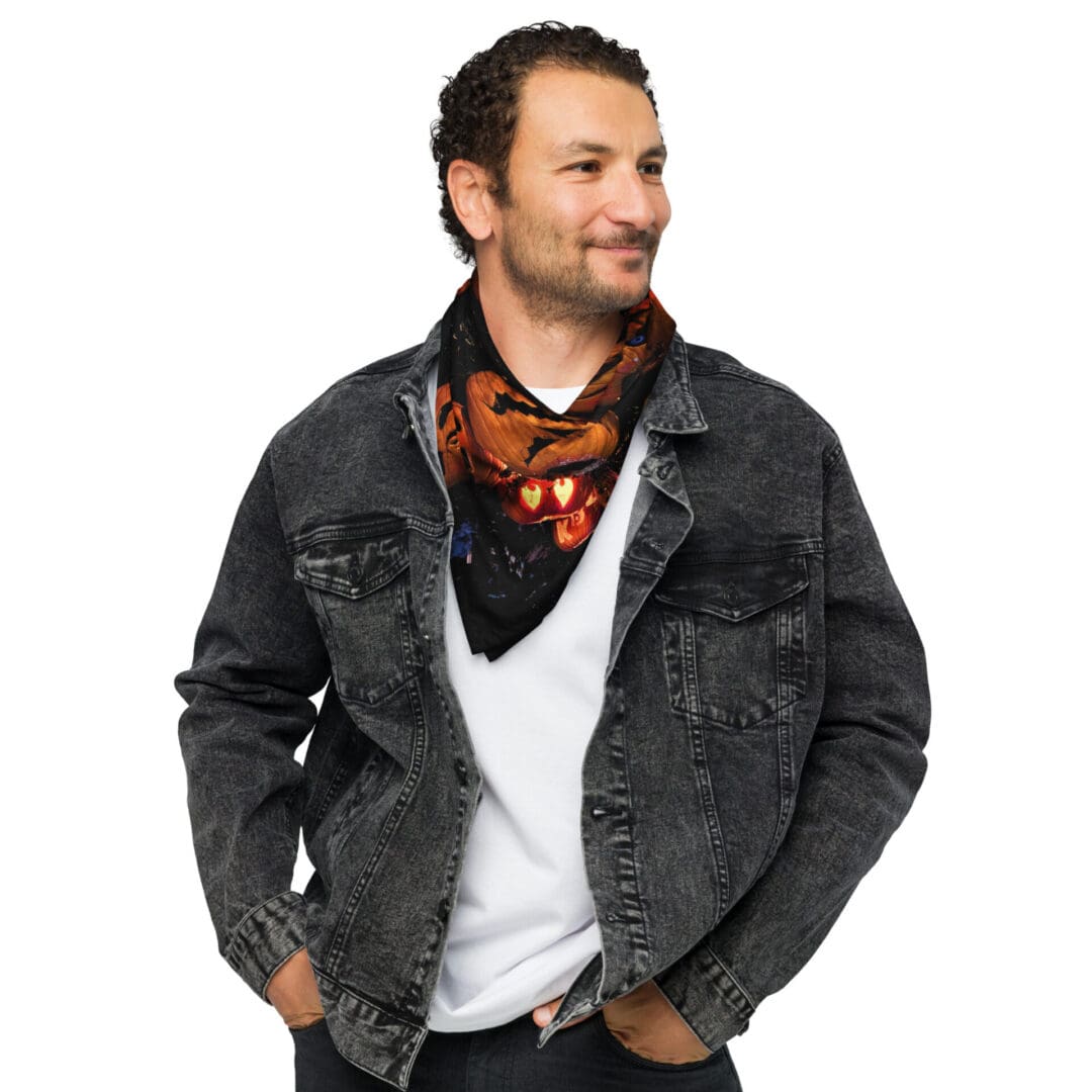 Man wearing denim jacket and patterned scarf.