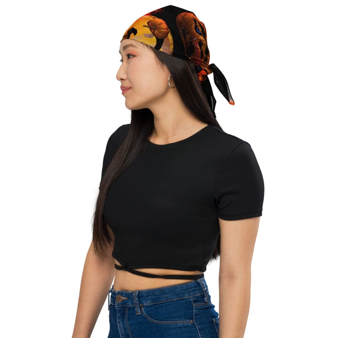 Woman wearing black top and bandana.