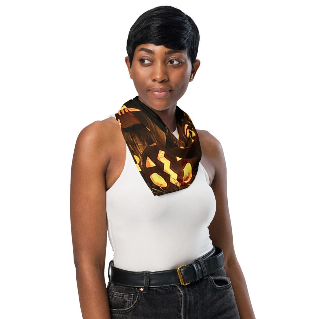 Woman wearing pumpkin-themed Halloween scarf.